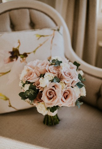 Pink and White bride bouquet on chair at Hedsor House wedding venue Buckinghamshire