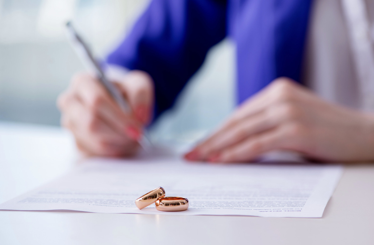 A set of rings next to paperwork
