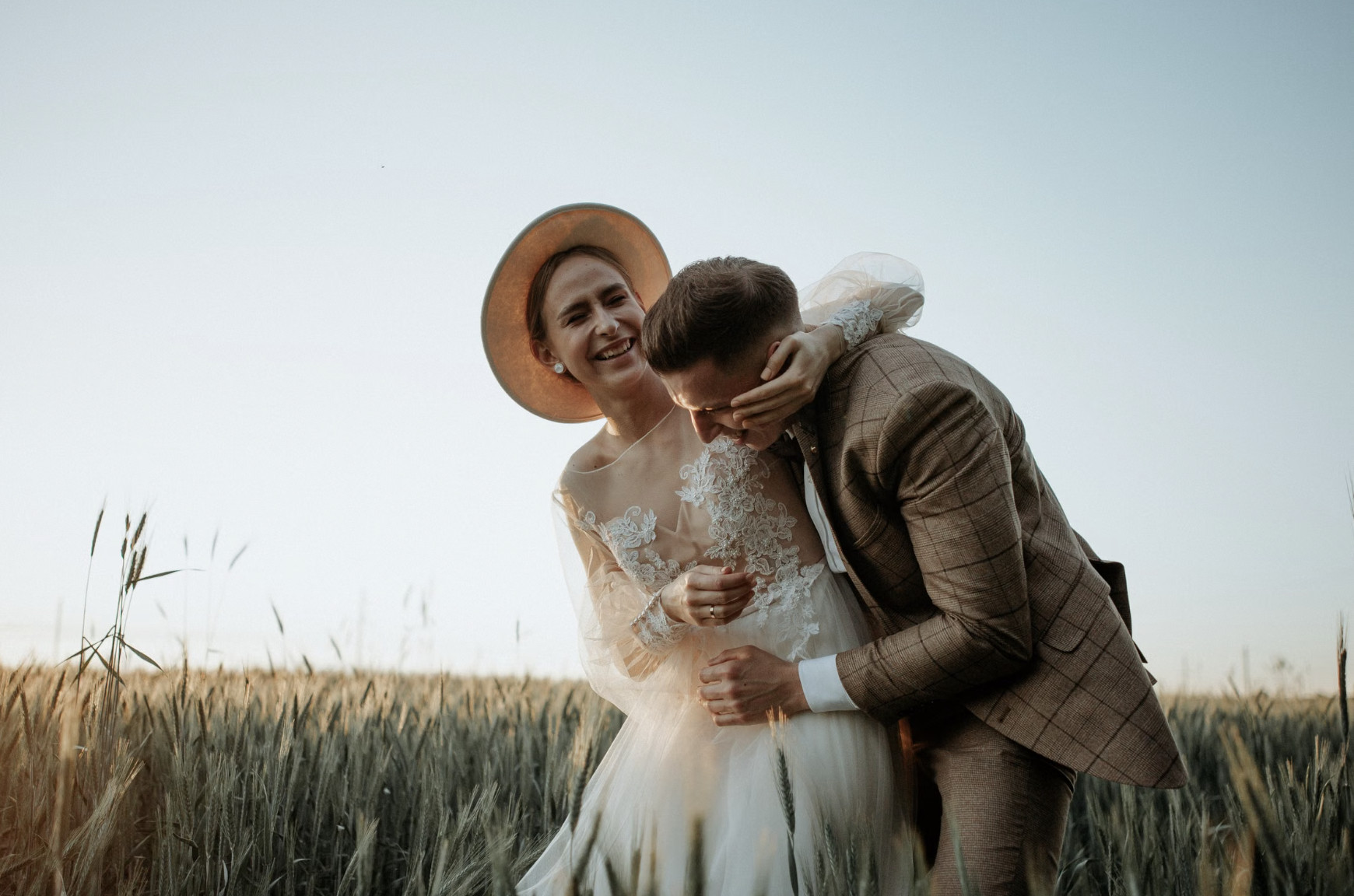 bride and groom with tweed suit