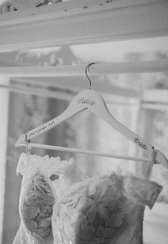 Bride dress on personalised hanger at Southdowns Manor wedding venue