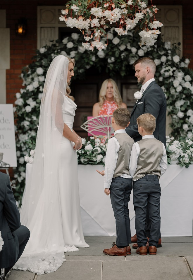 Bride and groom with page boys