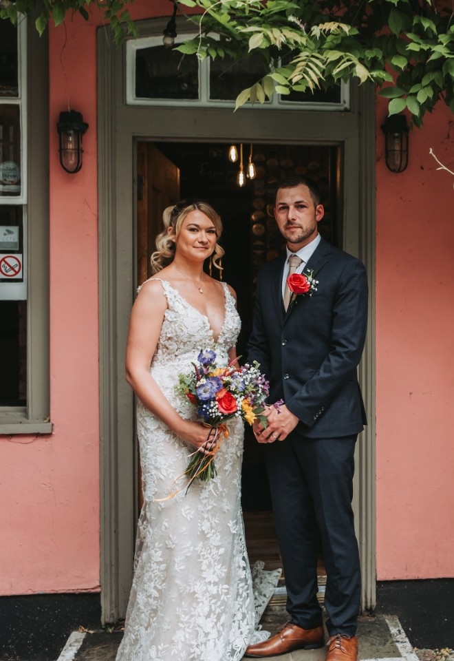 Rosie and Kyle Standing outside The Thistle & Crown