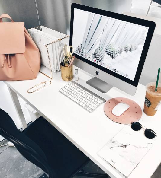 computer with coffee next to it