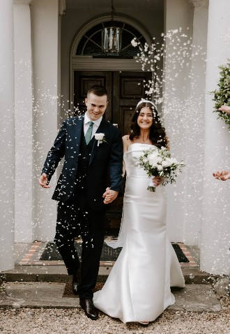 Wedding couple confetti moment at Glewstone Court