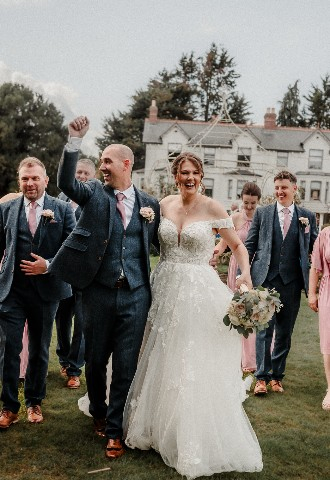 Wedding couple and bridesmaids and groomsmen photo outside Southdowns Manor West Sussex