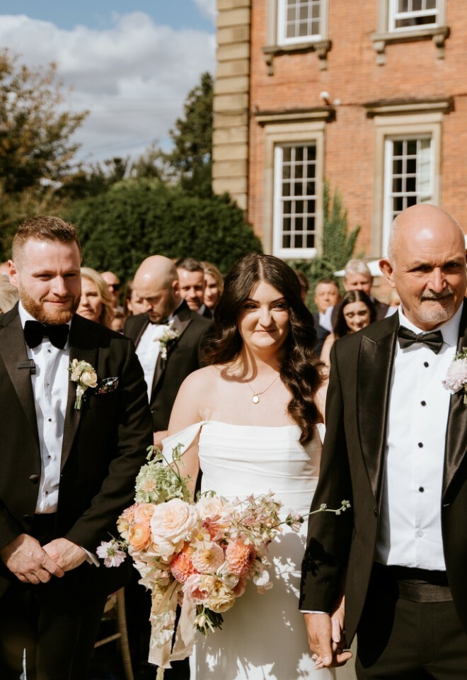 Brides father walking her down the aisle