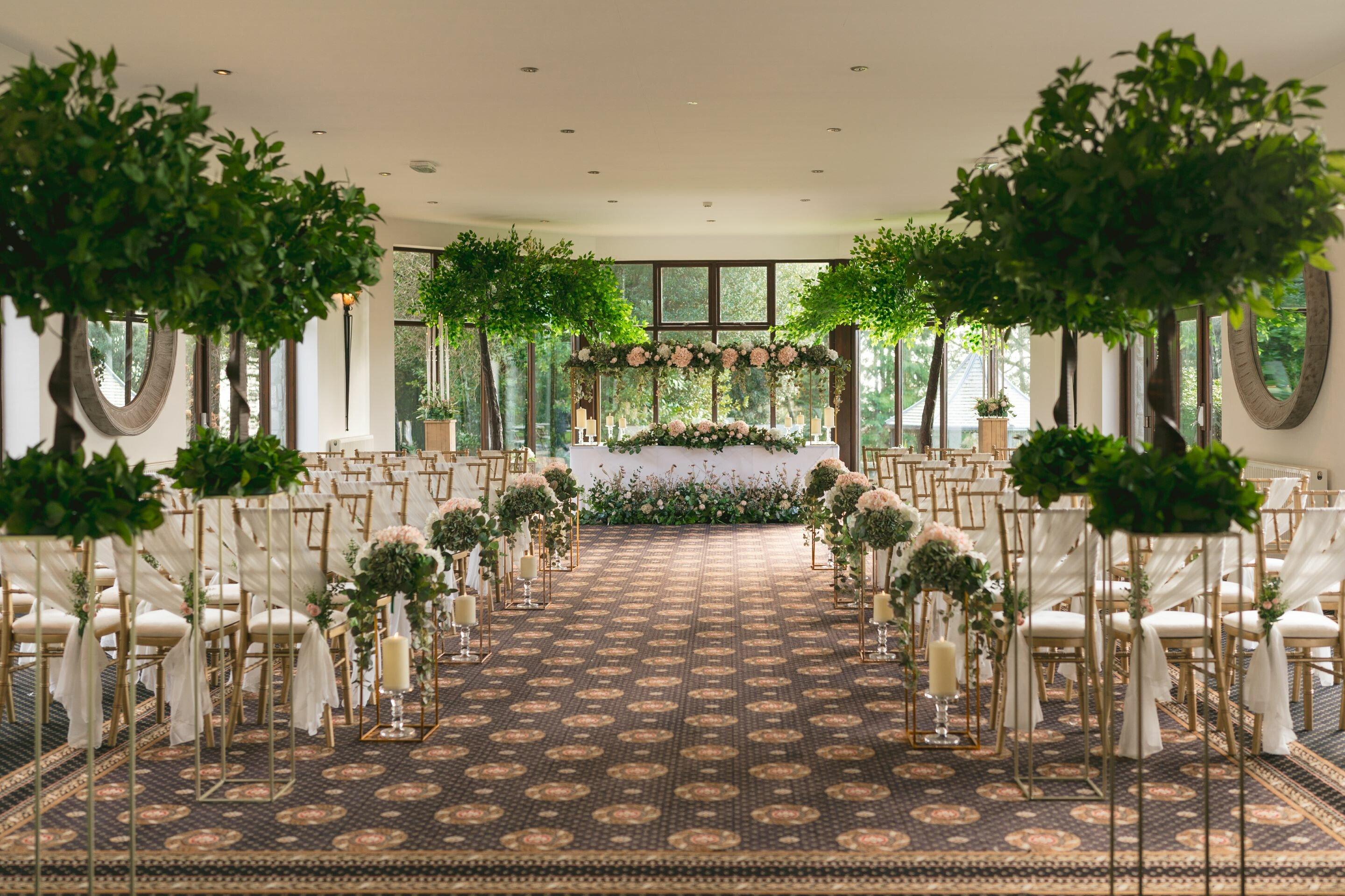 Garden Room at Bron Eifion Hotel set for a wedding ceremony
