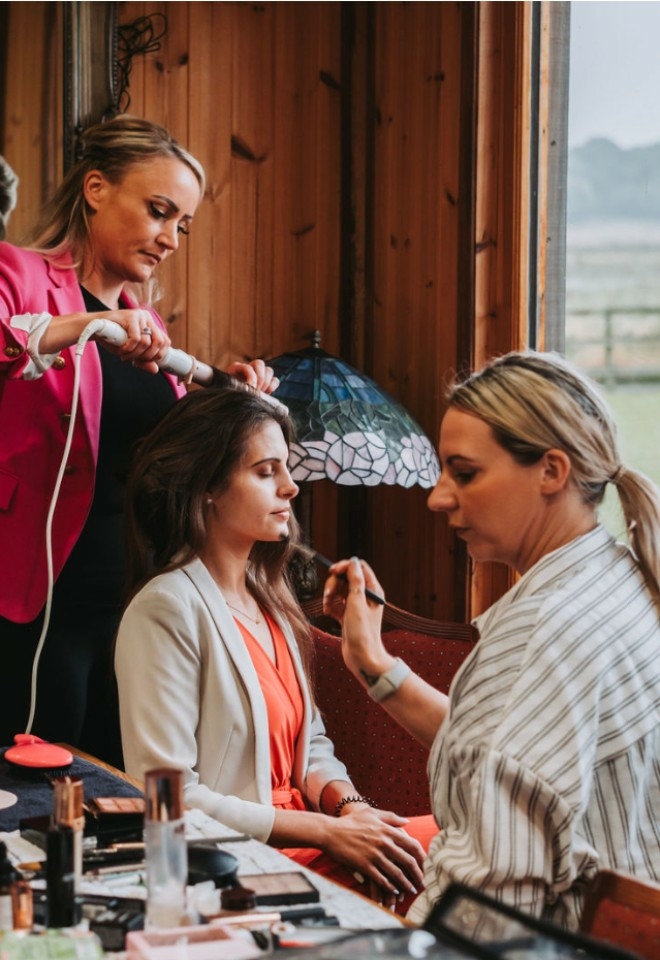 Bride model getting her hair and makeup done