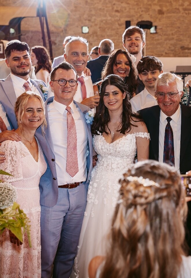 Bride and Groom with guests on wedding day