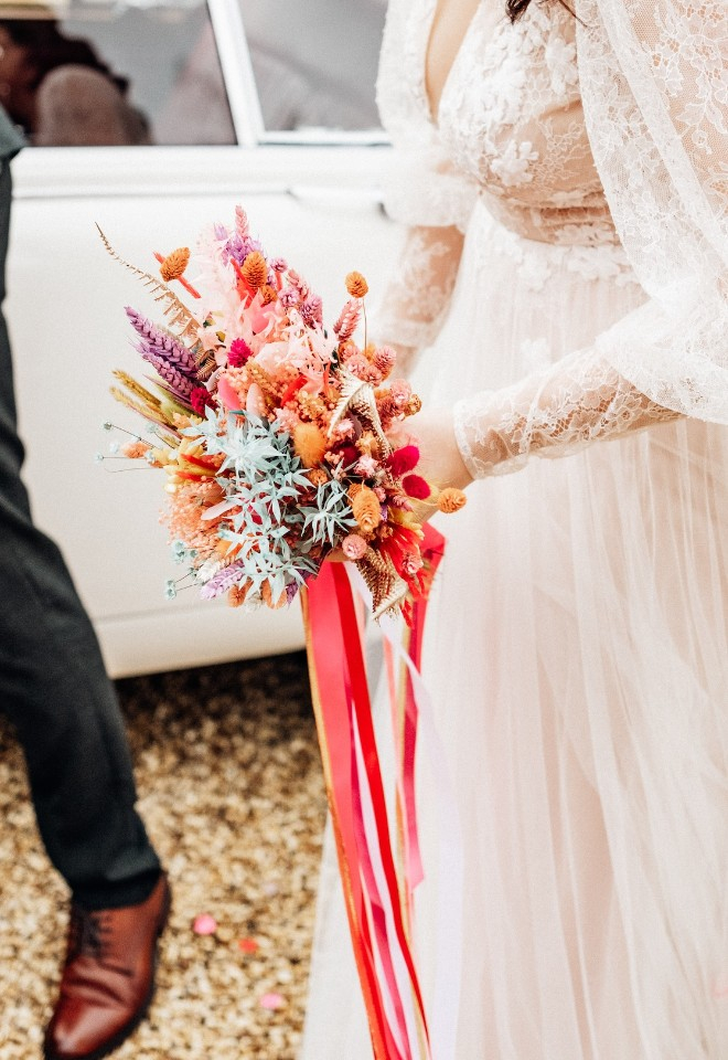 Bride with colourful dried flower bouquet