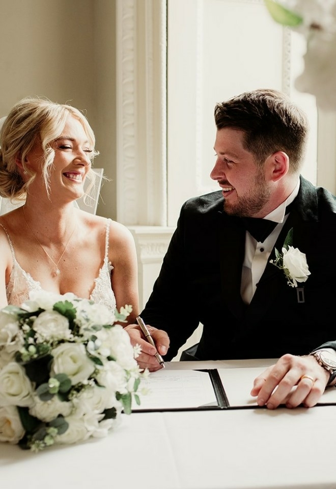 Chloe and Willian signing papers