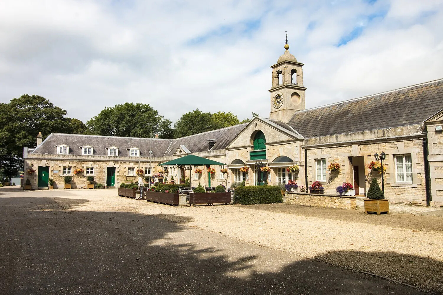 Normanton Park Hotel in Rutland, a historic stone hotel with courtyard entrance, clock tower and gardens near Rutland Water.