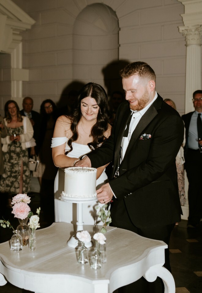 Bride and groom cutting their cake