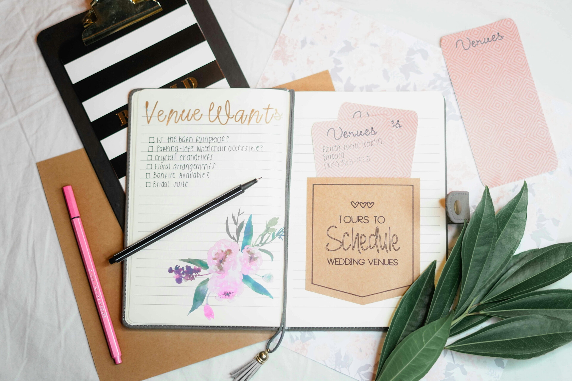 Wedding planning notebook with venue checklist, research notes and wedding organisation tools