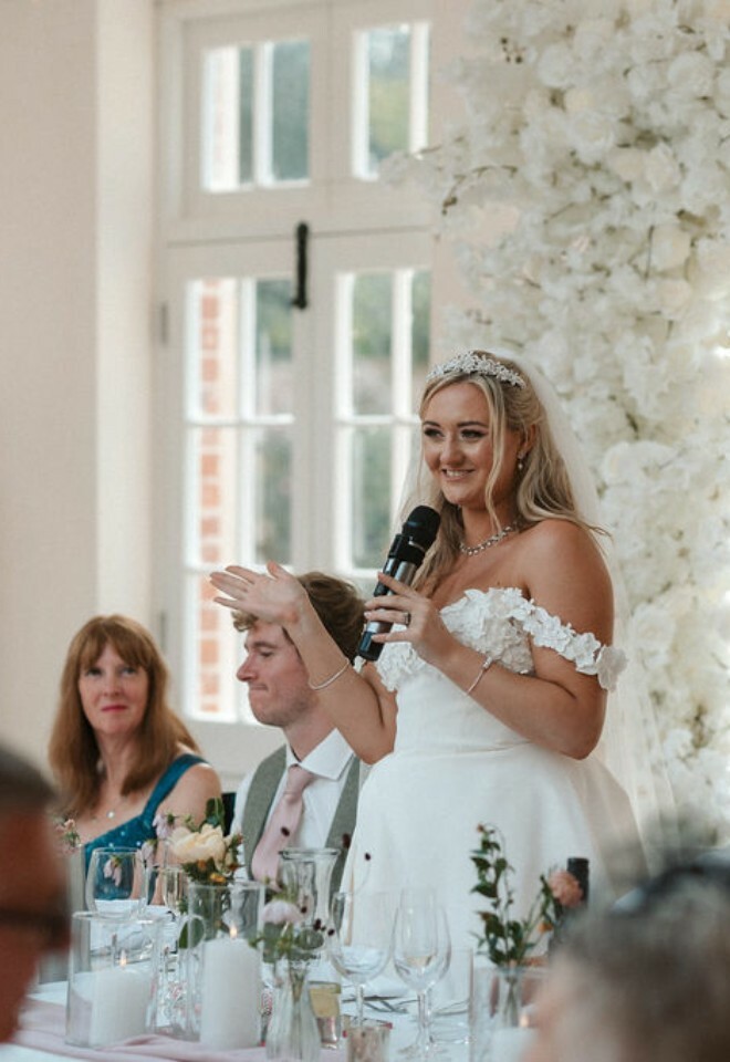 Bride gives speech in Elmhay Park orangery on wedding day