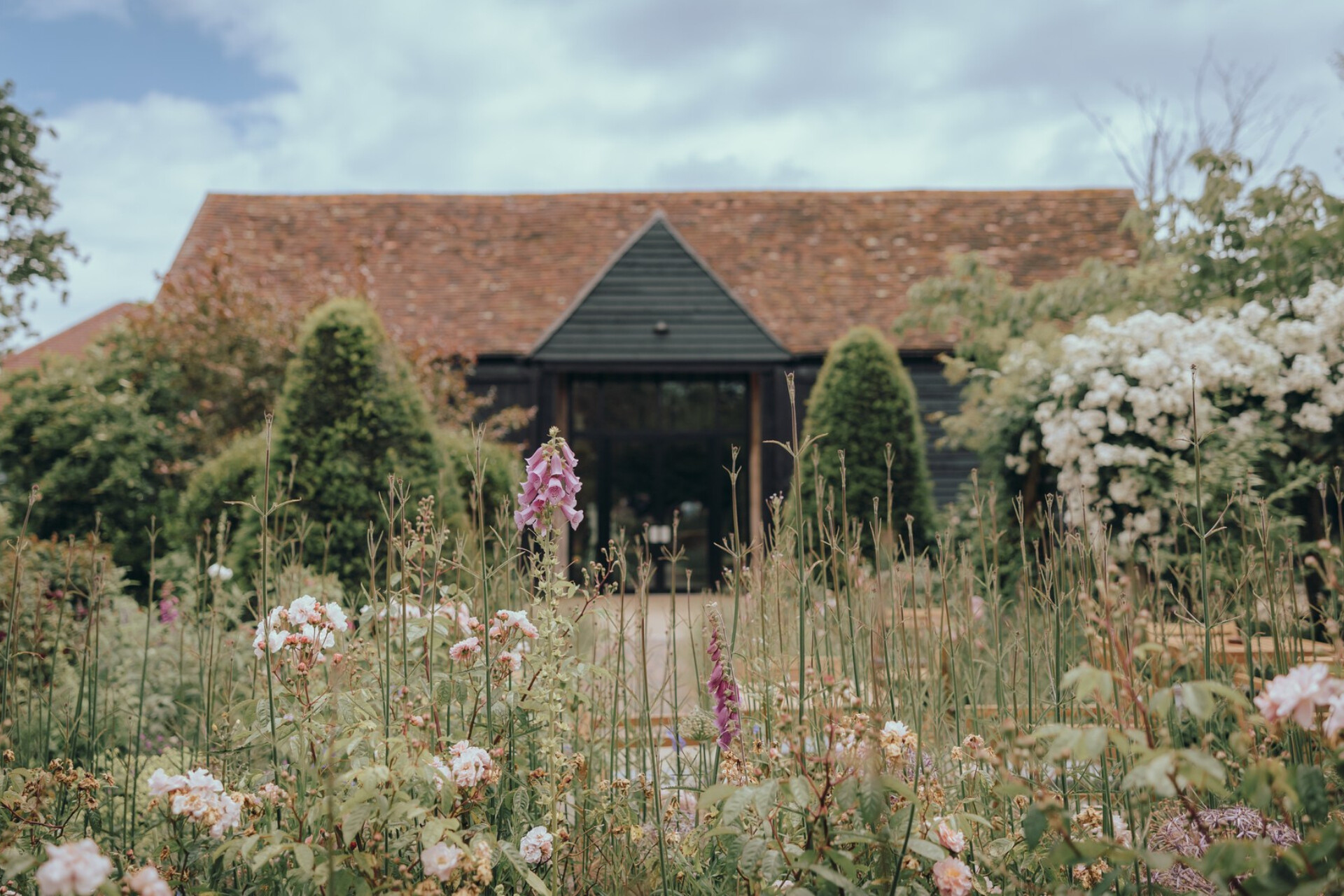 The landscaped gardens at Alfriston Gardens wedding venue in East Sussex, designed by RHS Chelsea Flower Show Gold Medallist Juliet Sargeant.