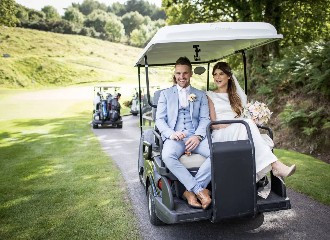 St Mellion Estate bride and groom on golf cart