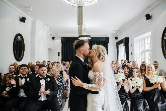Melissa and James share a first kiss on their wedding day