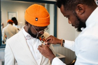 Groom getting ready on wedding morning with best man