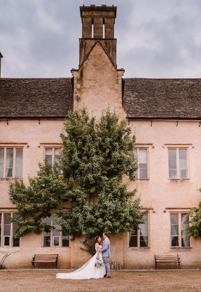 Bride and Groom outside Cogges Manor Farm Wedding Venue