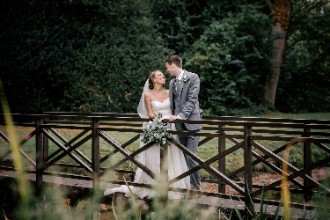 bride and groom on Ardington House bridge