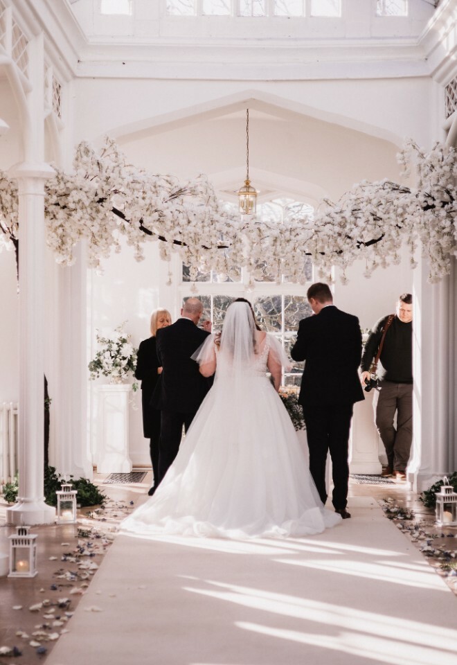 wedding couple at end of aisle