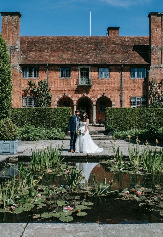 Couple stood in front of mansion at Port Lympne Hotel 