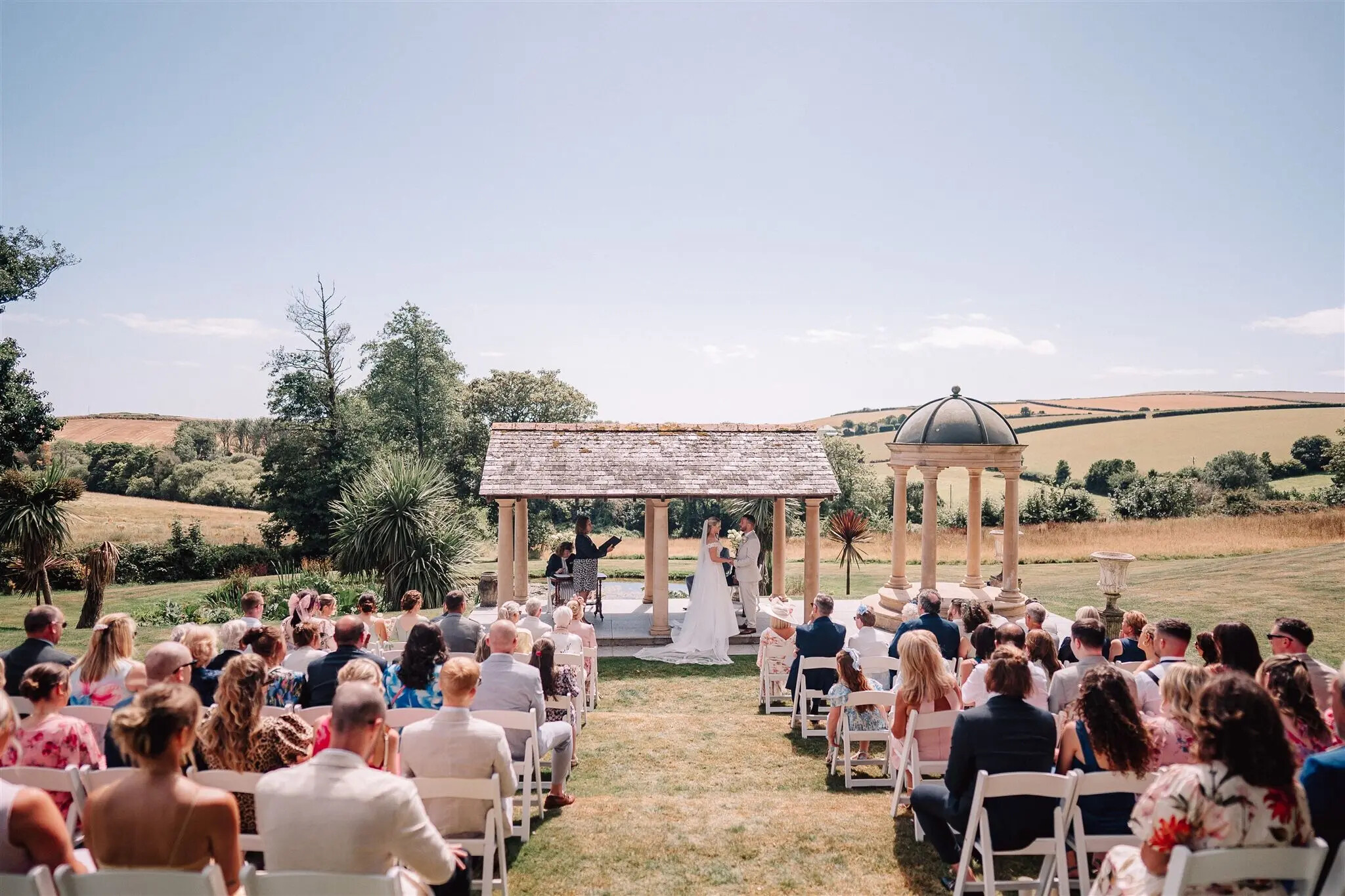 tredudwell manor wedding ceremony outside under gazebo