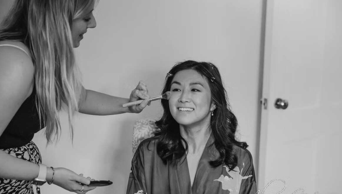 bride getting makeup done by Hair and Makeup by Beth Oxfordshire-based hair and makeup artist 