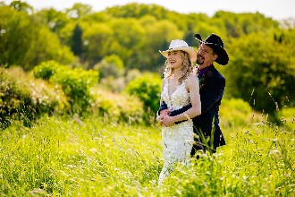 Groom holding bride in his arms