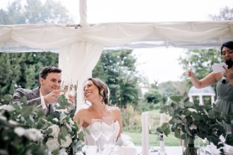 Bride and groom cheers at Ardington House Wedding