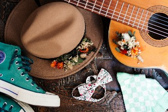 Grooms outfit accessories layed out on wedding morning 