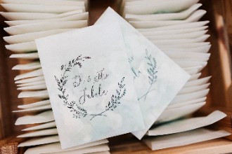 Confetti in white paper bags at wedding