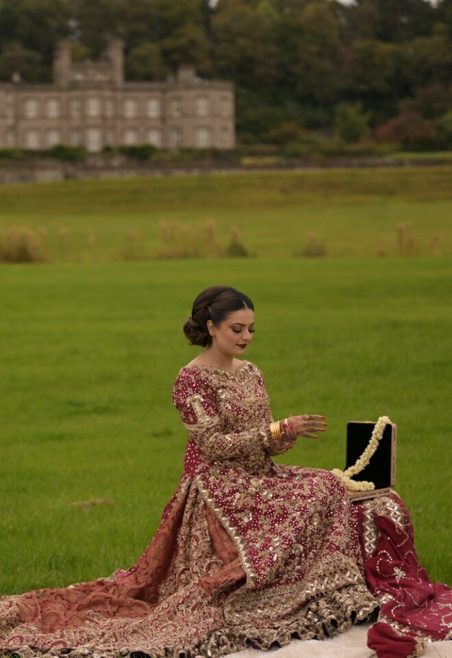 Bride wearing her jewellery in the open grounds 