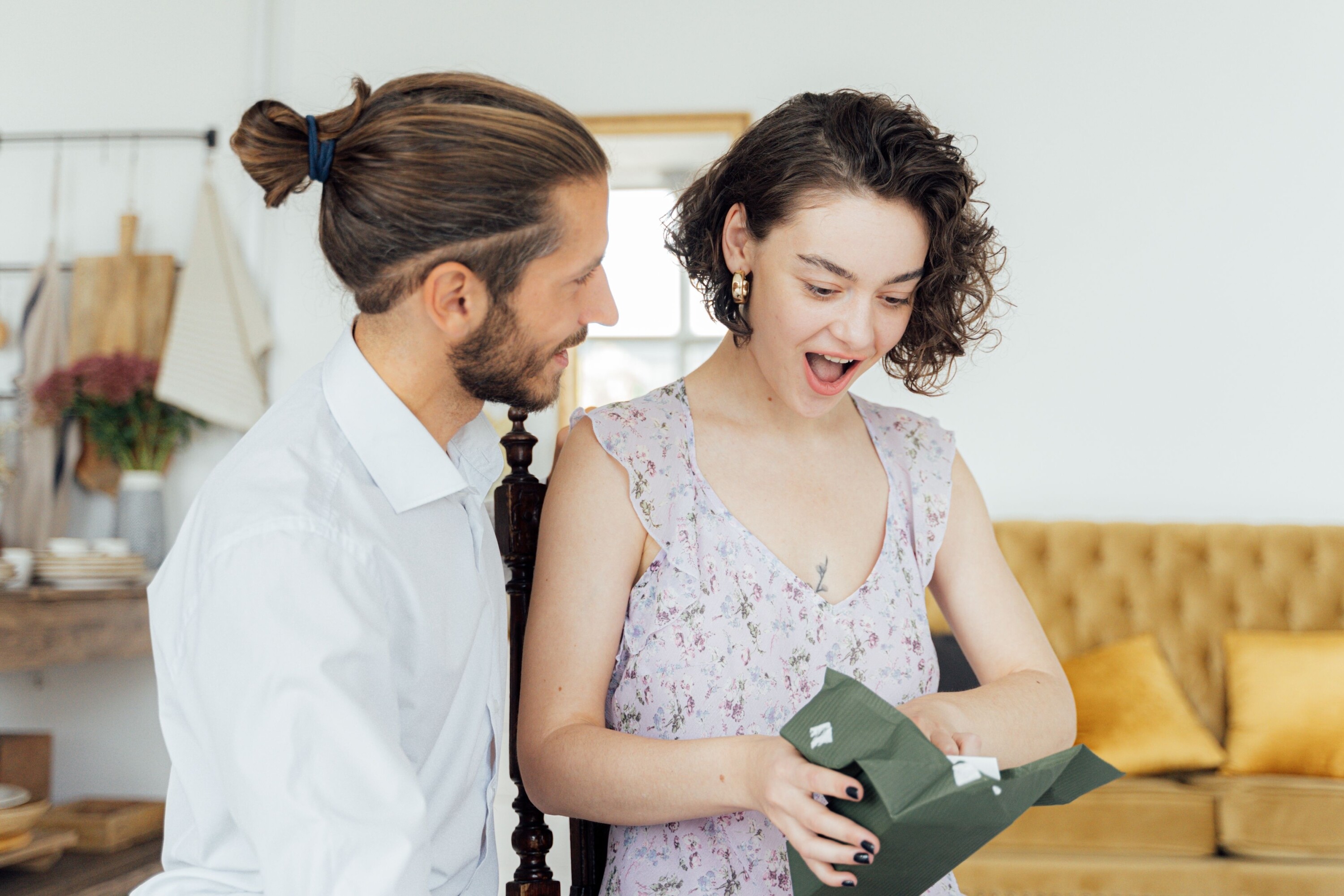 Couple opening a gift