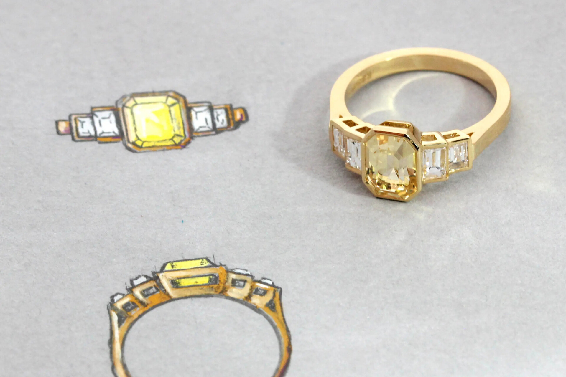 Bespoke gold engagement ring with yellow gemstone and jewellery design sketches