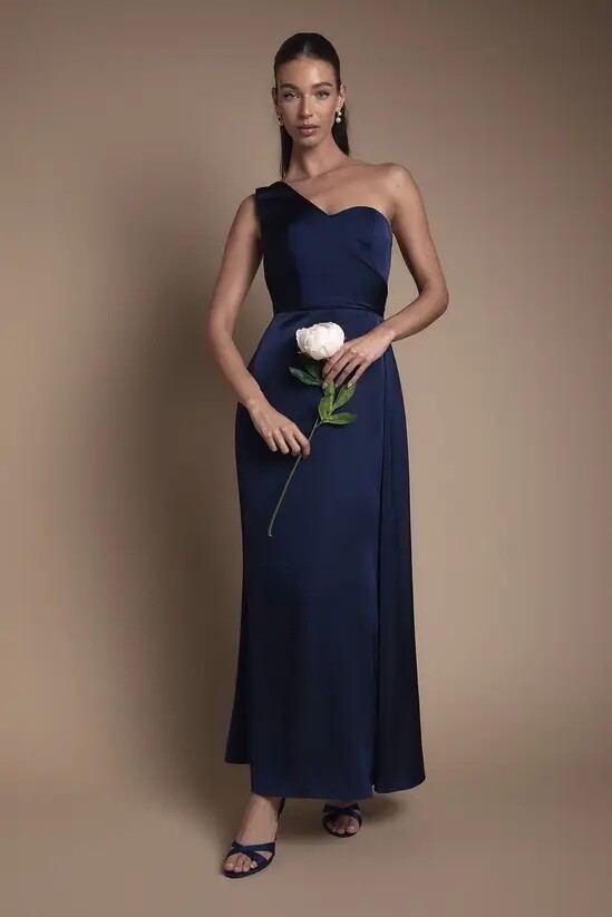 navy one shoulder bridesmaid dress with wrap bodice and full length skirt for winter wedding