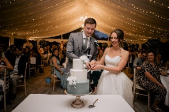 Bride and Groom cutting cake at Ardington House Wedding