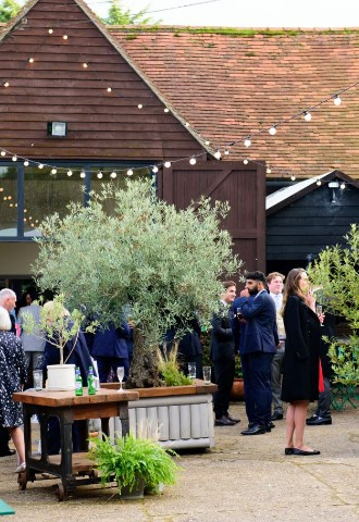 Arrival drinks in the courtyard at Monkton Barn