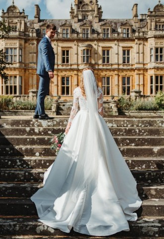 Bride and Groom outdoors in front of Westonbirt Weddings & Events Gloucestershire