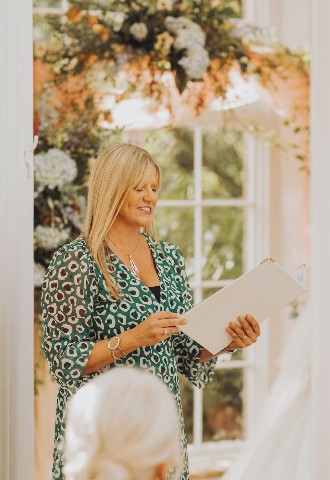 Celebrant Lisa reading a ceremony at St Audries