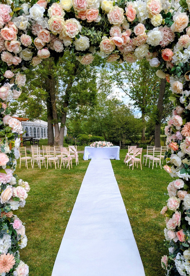 Flower arch outside ceremony