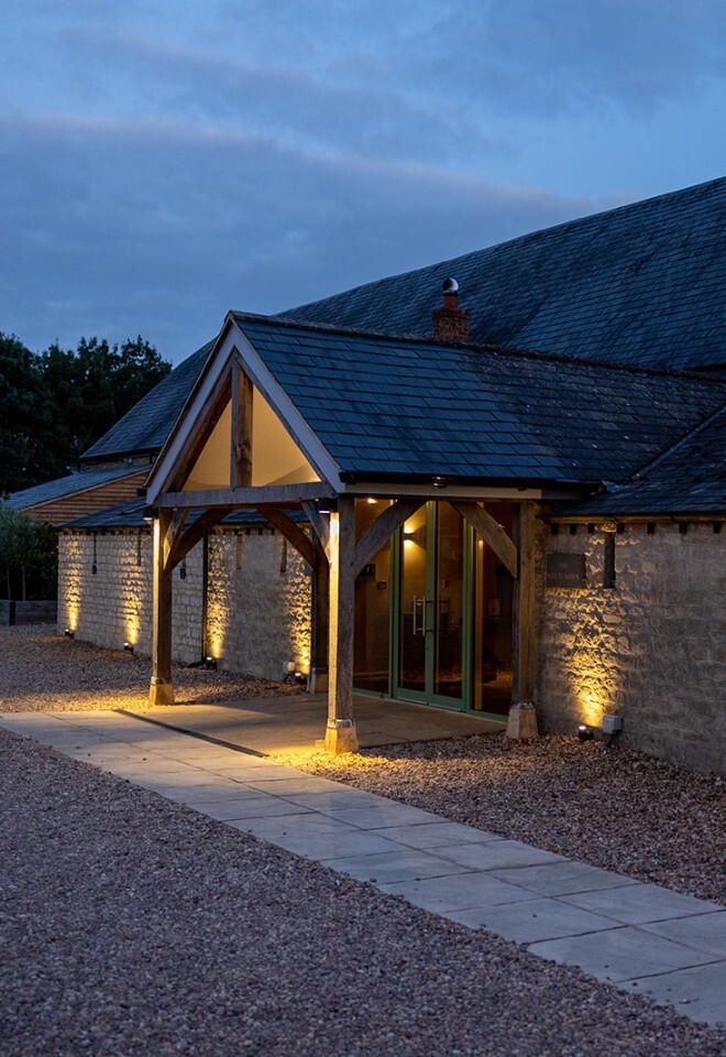The grounds and barn at an exclusive Oxfordshire barn wedding venue