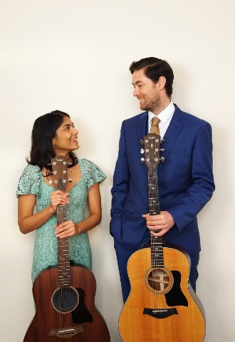 acoustic duo holding instruments