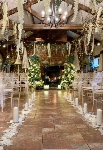 Skitby wedding aisle in their barn. Cumbria wedding venue.