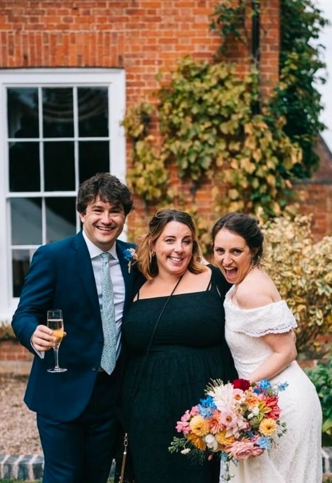  A WEDDING COUPLE WITH THEIR WEDDING PLANNER