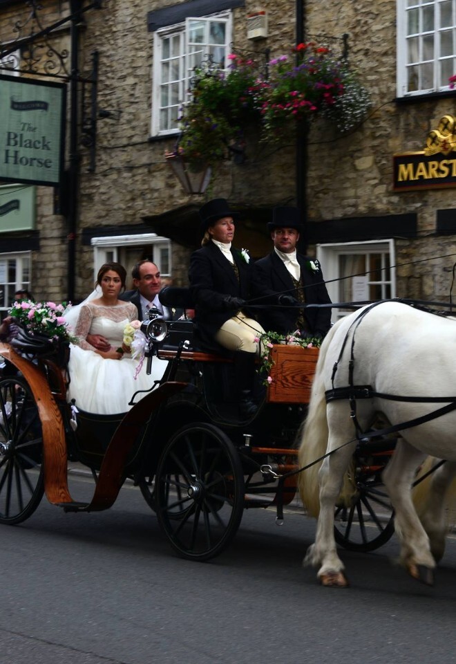 wedding white horse drawn open top carriage hire gloucestershire. bride and father of the bride off to the wedding