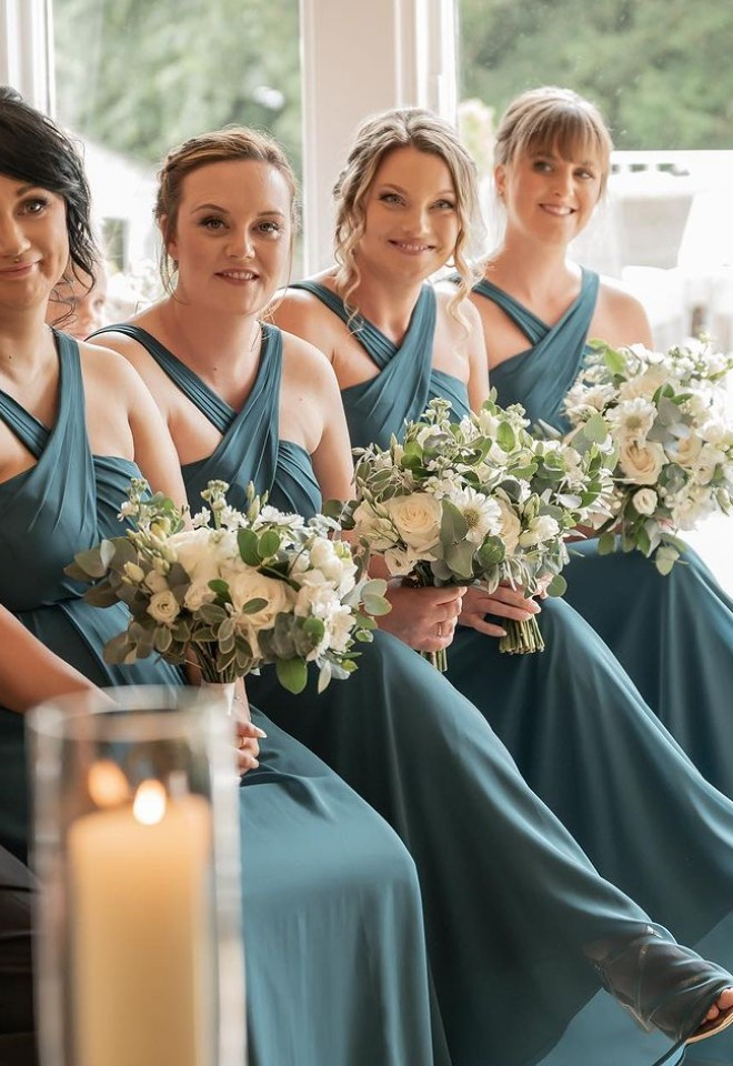 Bridesmaids flowers during wedding ceremony