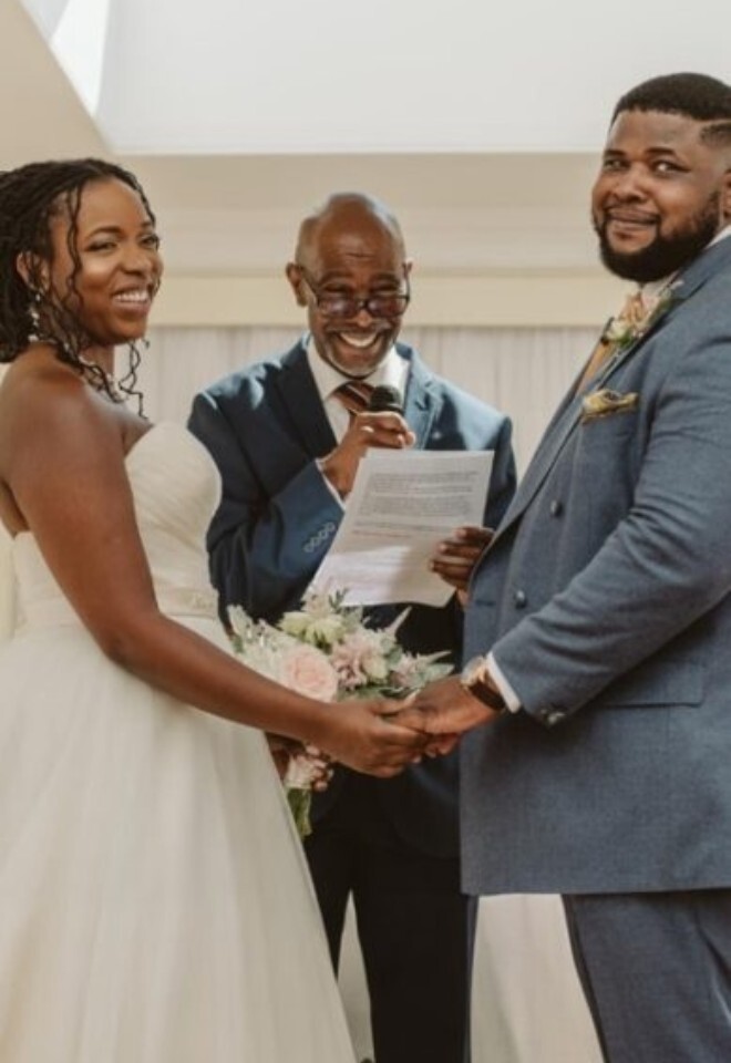 Bride and groom holding hands during a wedding ceremony led by Chris Lowe Wedding Celebrant in Sittingbourne Kent