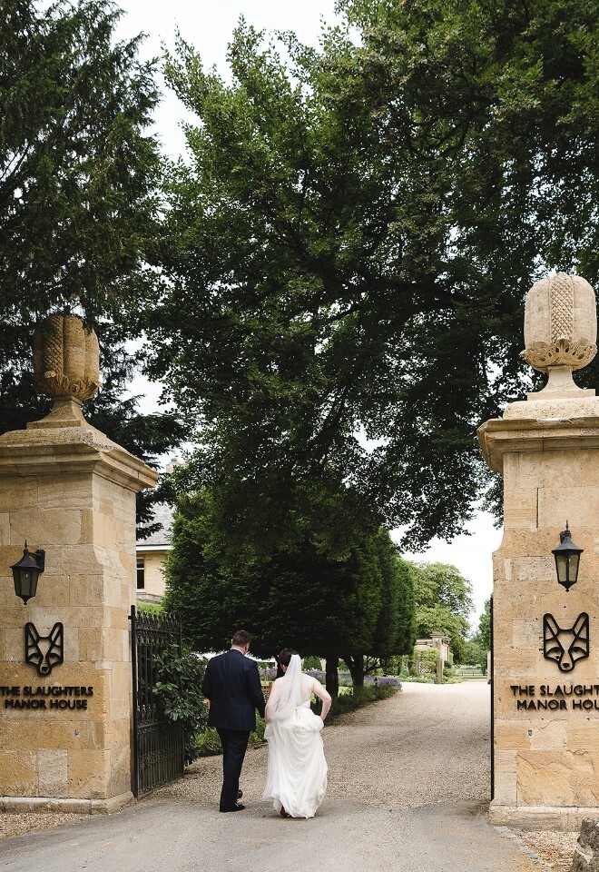 Bride and Groom at entrance of Slaughters Manor